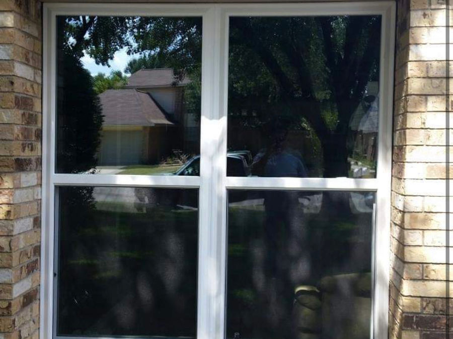 Residential 4-pane window on brick house exterior