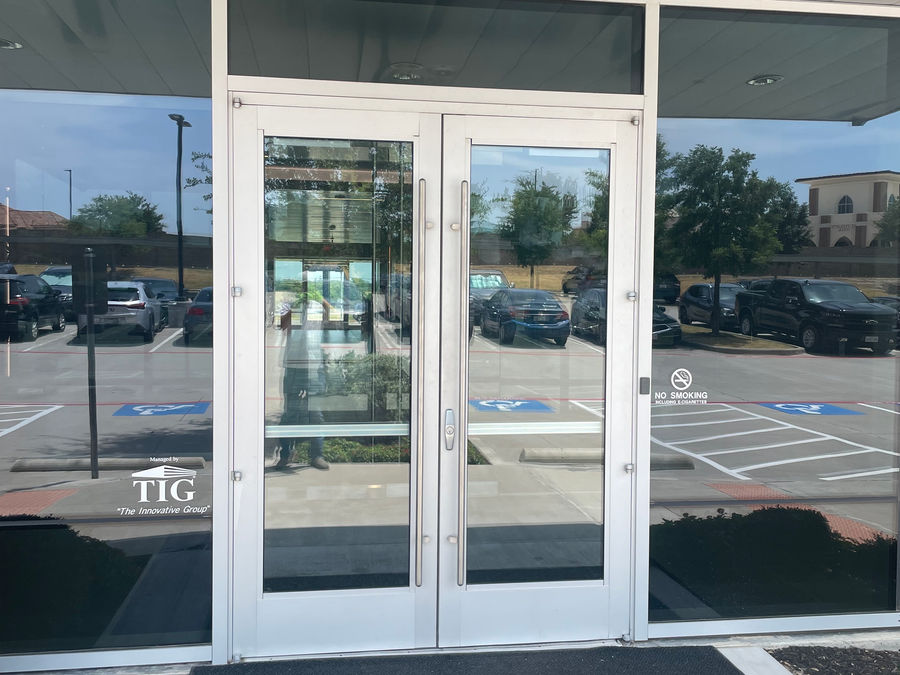 Commercial glass entry doors at TIG building