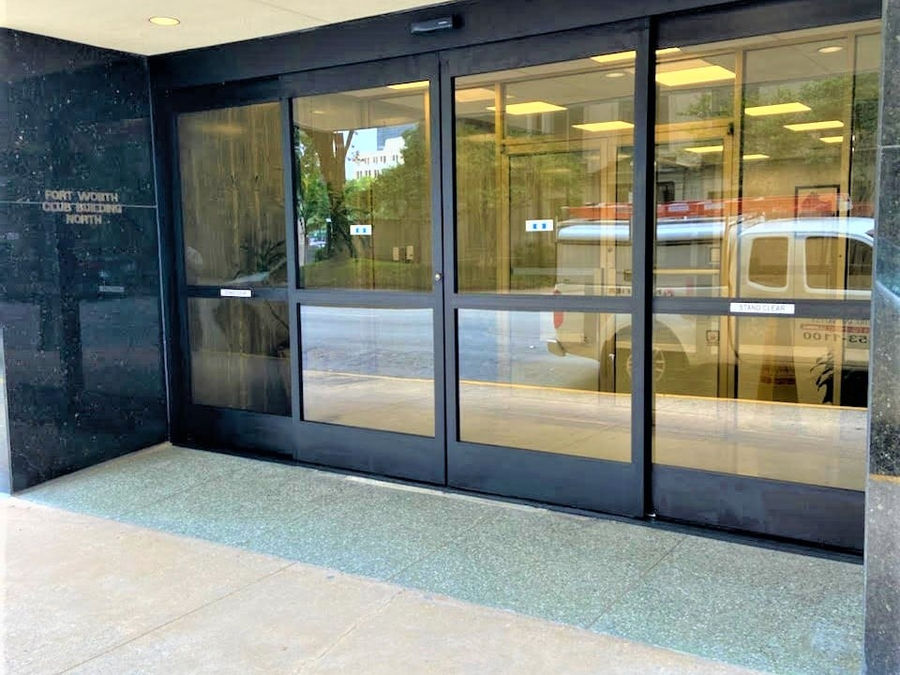 Commercial storefront glass entrance at Fort Worth Club Building